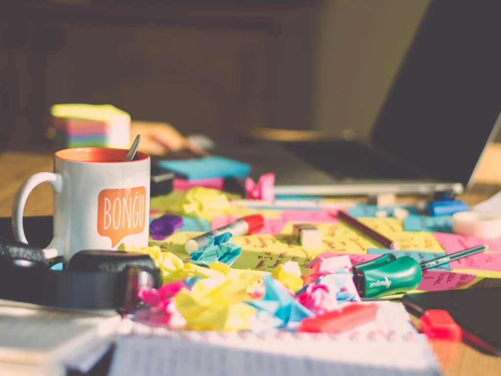 photograph-of-a-cluttered-desk-containing-post-its-article