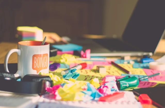 photograph-of-a-cluttered-desk-containing-post-its-article